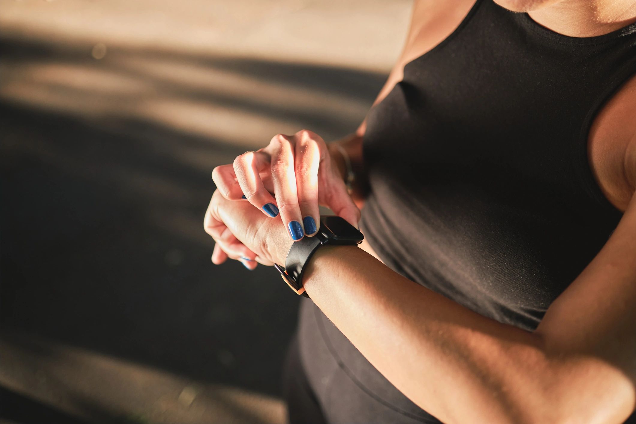 Athlete checking a smartwatch after a run