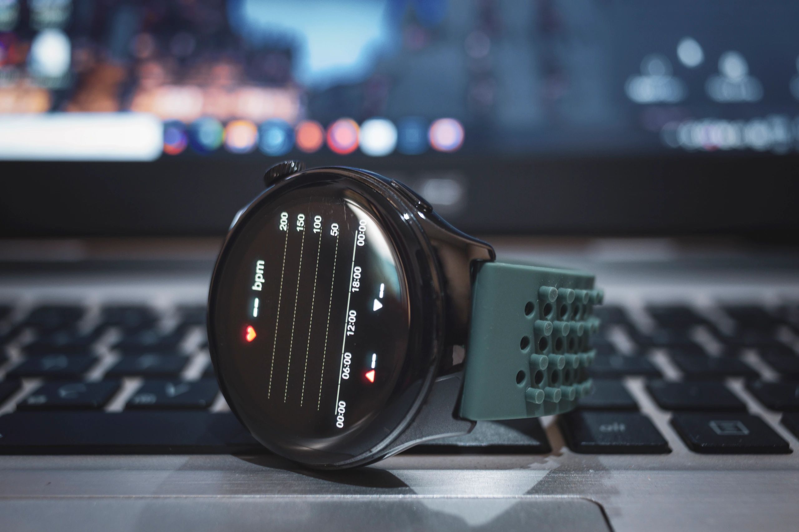 Smartwatch showing heart-rate graph on a dark screen
